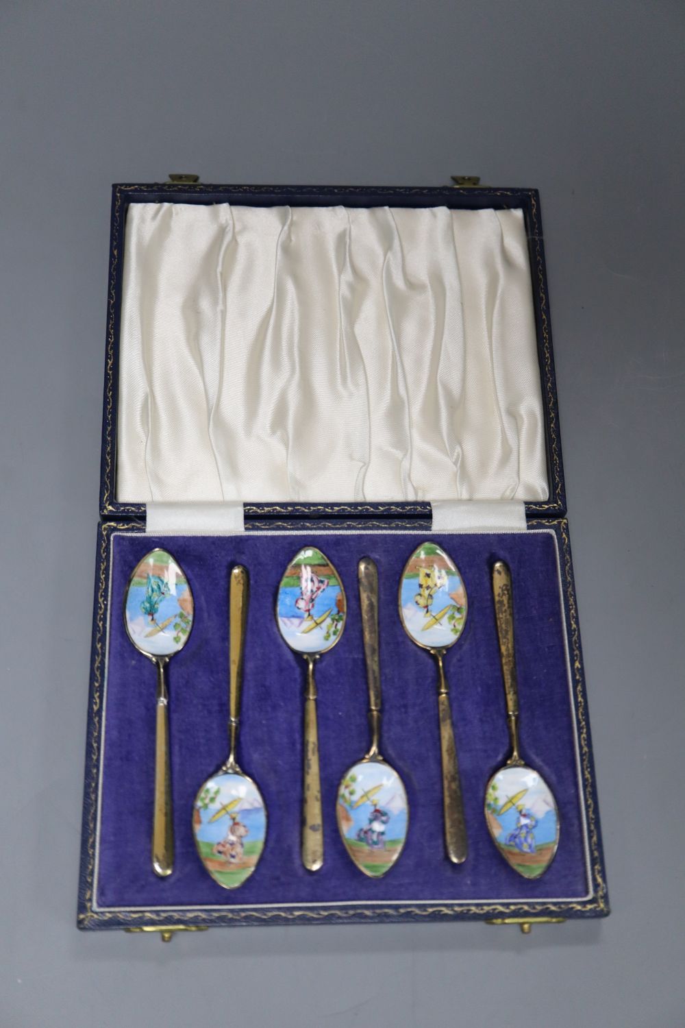 A cased set of six silver gilt and chinoiserie decorated enamel teaspoons, Birmingham, 1965.